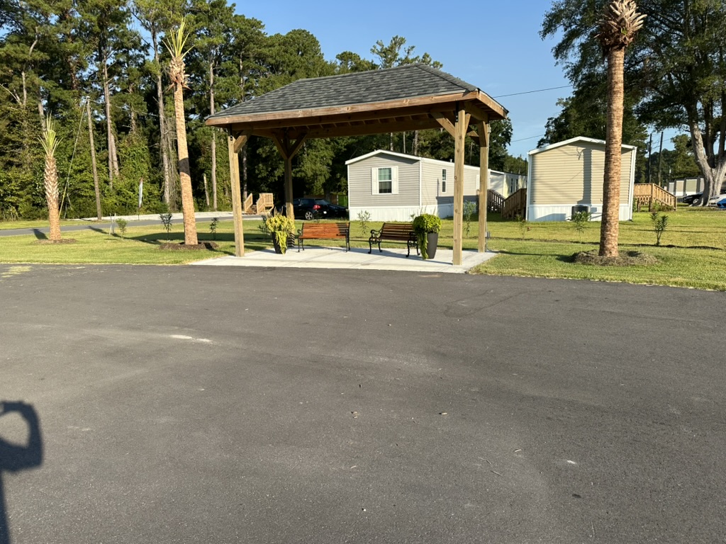 Covered pavilion with benches and landscaping